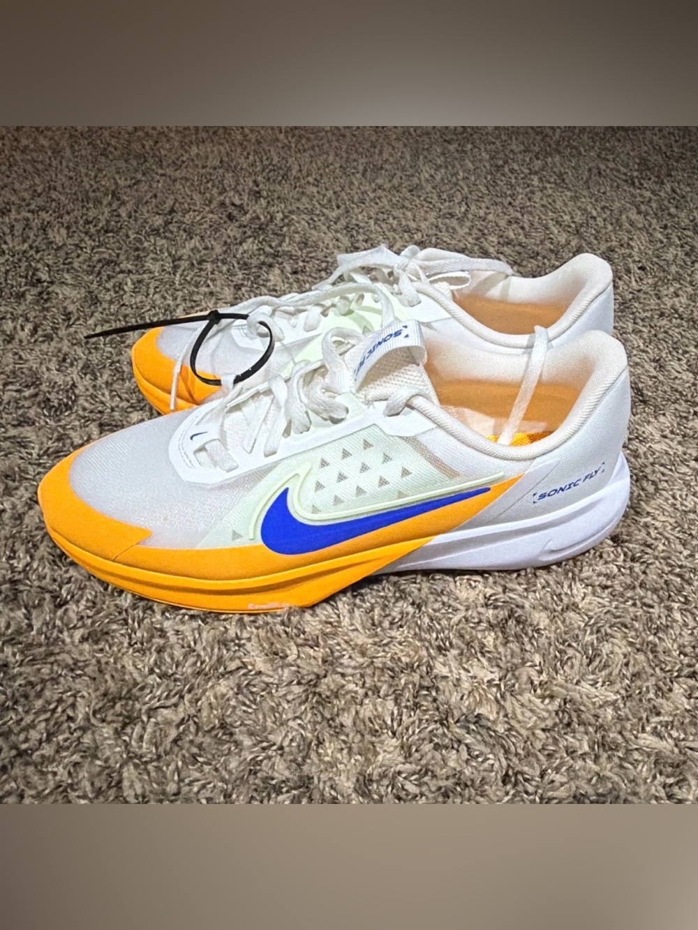 Nike White and Yellow Athletic Shoes with Blue Swoosh